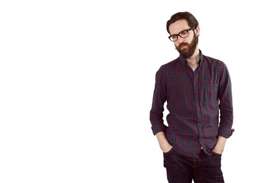 Handsome hipster with hands in pockets