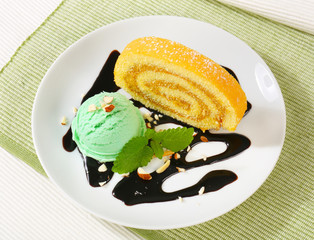Swiss Roll with scoop of green sherbet