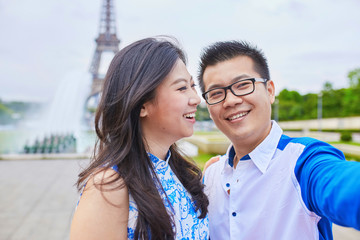 Young romantic Asian couple in Paris