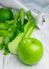 Ingredients for green smoothie with apple, celery and lime