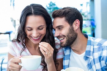 Cute couple having coffee together