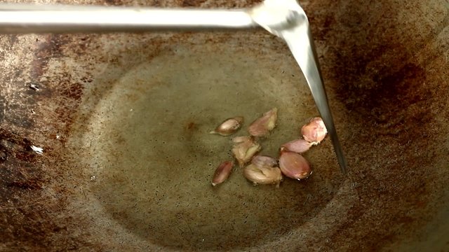 frying garlic in pan