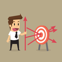 businessman throwing arrows at the target precisely, goal of the