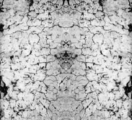 Grungy stone wall two horizontal cracks.