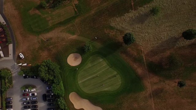 Drone slowly flying high above a golf course in Germany.