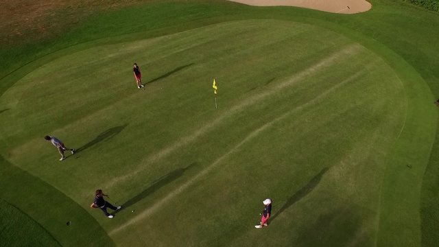 Aerial perspective of four player at the golf course in Bad Homburg filmed by a drone.