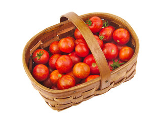 Fresh red cherry tomatoes in a basket isolated white background