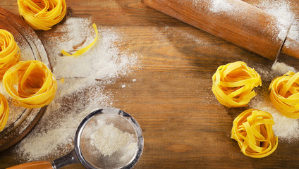 Pasta   on a old rustic wooden background.