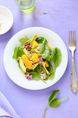 salad with slice of orange and avocado