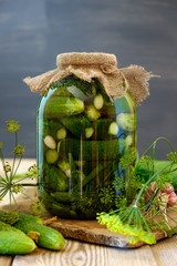 Jar of pickles on wooden table