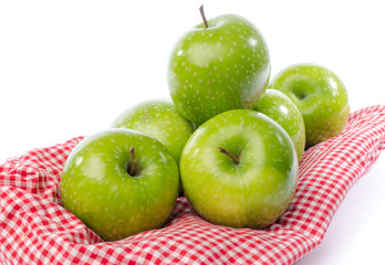Fresh green apples on towel