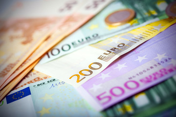 Closeup of euro banknotes and coins