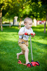 Boy riding on a scooter