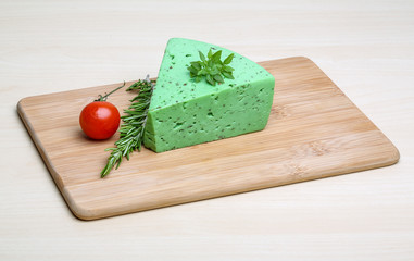 Green pesto cheese and basil leaves