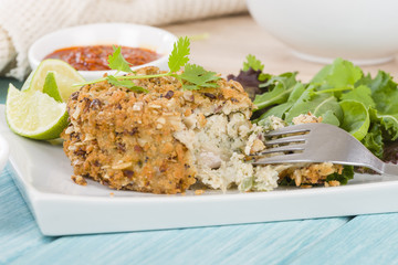 Fishcake - Deep-fried tuna, lime and coriander fishcake served with salad.
