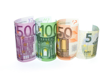 Euro banknotes of various denominations on a white background