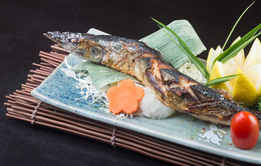 japanese cuisine. fried fish on the background