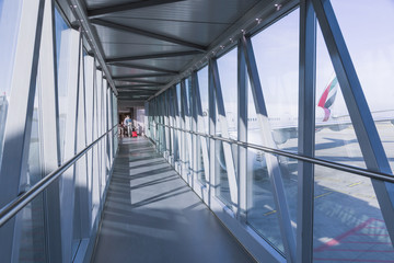 corridor for passage to boarding in plane - obrazy, fototapety, plakaty