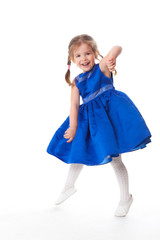 beautiful little girl in a blue dress dancing
