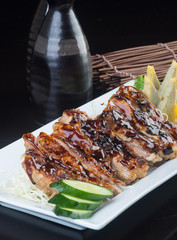 japanese cuisine. grilled chicken on the background