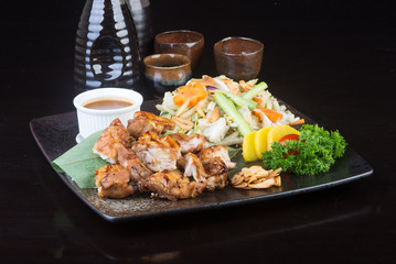 japanese cuisine. grilled chicken on the background