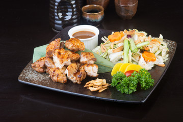 japanese cuisine. grilled chicken on the background