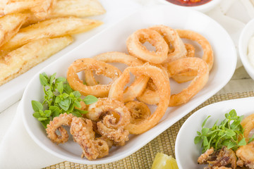 Calamari - Deep-fried squid rings served with garlic mayo and chili sauce.
