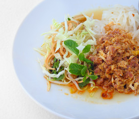 rice noodles with vegetables,pok and pair of chopsticks