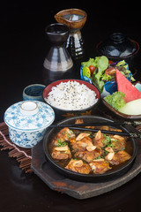 japanese cuisine. hot plate chicken on the background