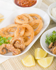 Calamari - Deep-fried squid rings served with garlic mayo and chili sauce.
