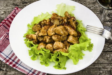 chicken in sauce with mushrooms and pineapple and spices