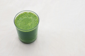 green smoothie on white background