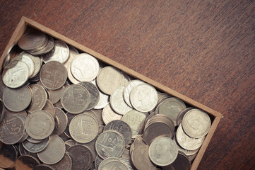 coins on wood with filter effect retro vintage style