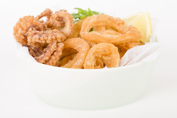 Calamari - Deep-fried squid rings served with lemon.
