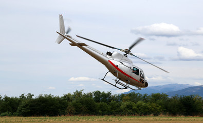 Fototapeta na wymiar helicopter takes off from the airport to bring tourists over the