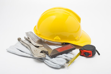 Fototapeta premium construction hat and gloves white backgrund