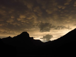 Weird clouds over mountains in the Swiss Alps
