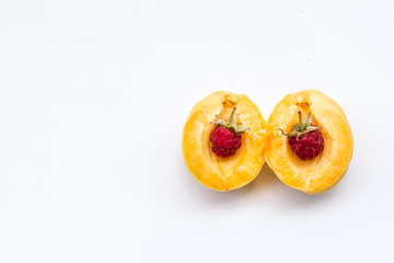 two raspberries in part apricot, copy space