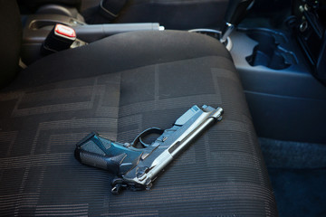 Gun in car - 87983163