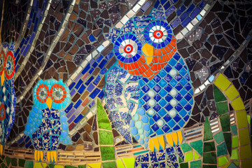 Painted stone owl on a palette