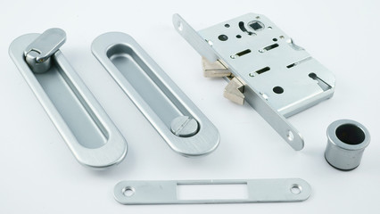 lock and handle on the door coupe in silver on a white background