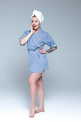Young beautiful slim woman wrapped in towel