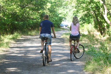  couple on bicycles  in the park