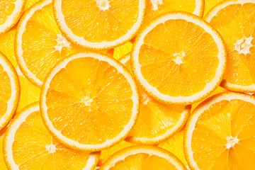 Zelfklevend Fotobehang Colorful orange fruit slices  © Dmitry Rukhlenko
