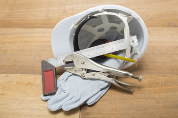 Fototapeta premium construction hat and gloves white backgrund