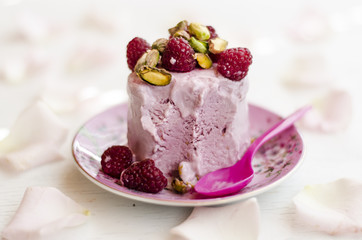 Raspberry ice cream with raspberry and pistachios  