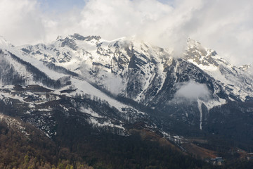 Snow-capped peaks of the Caucasus mountains in the ski resort Rosa Khutor, Sochi, Russia.