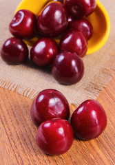 Fresh cherries on wooden table, healthy food