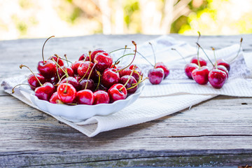 fresh red cherry in a plate,healthy snack, summer, selective foc