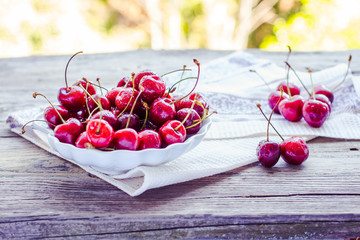 fresh red cherry in a plate,healthy snack, summer, selective foc
